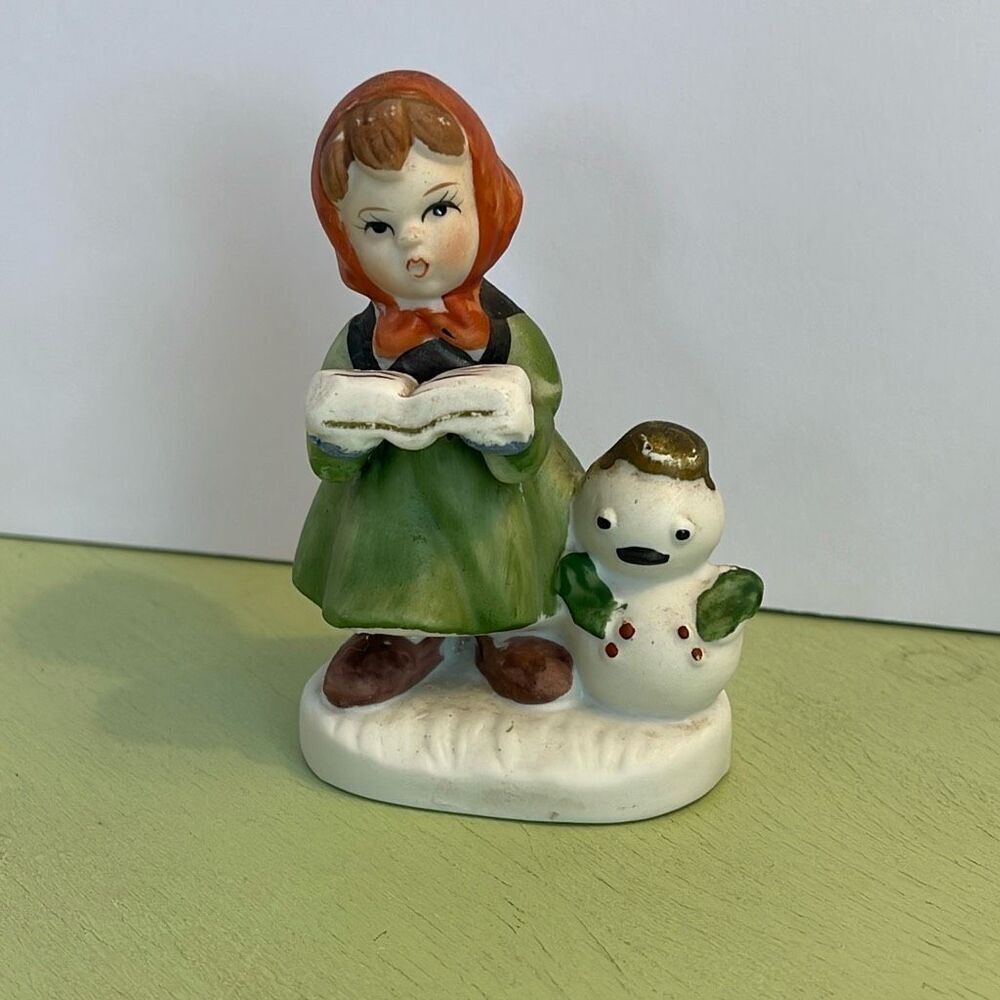 Vintage Flambro ceramic girl caroling with snowman.